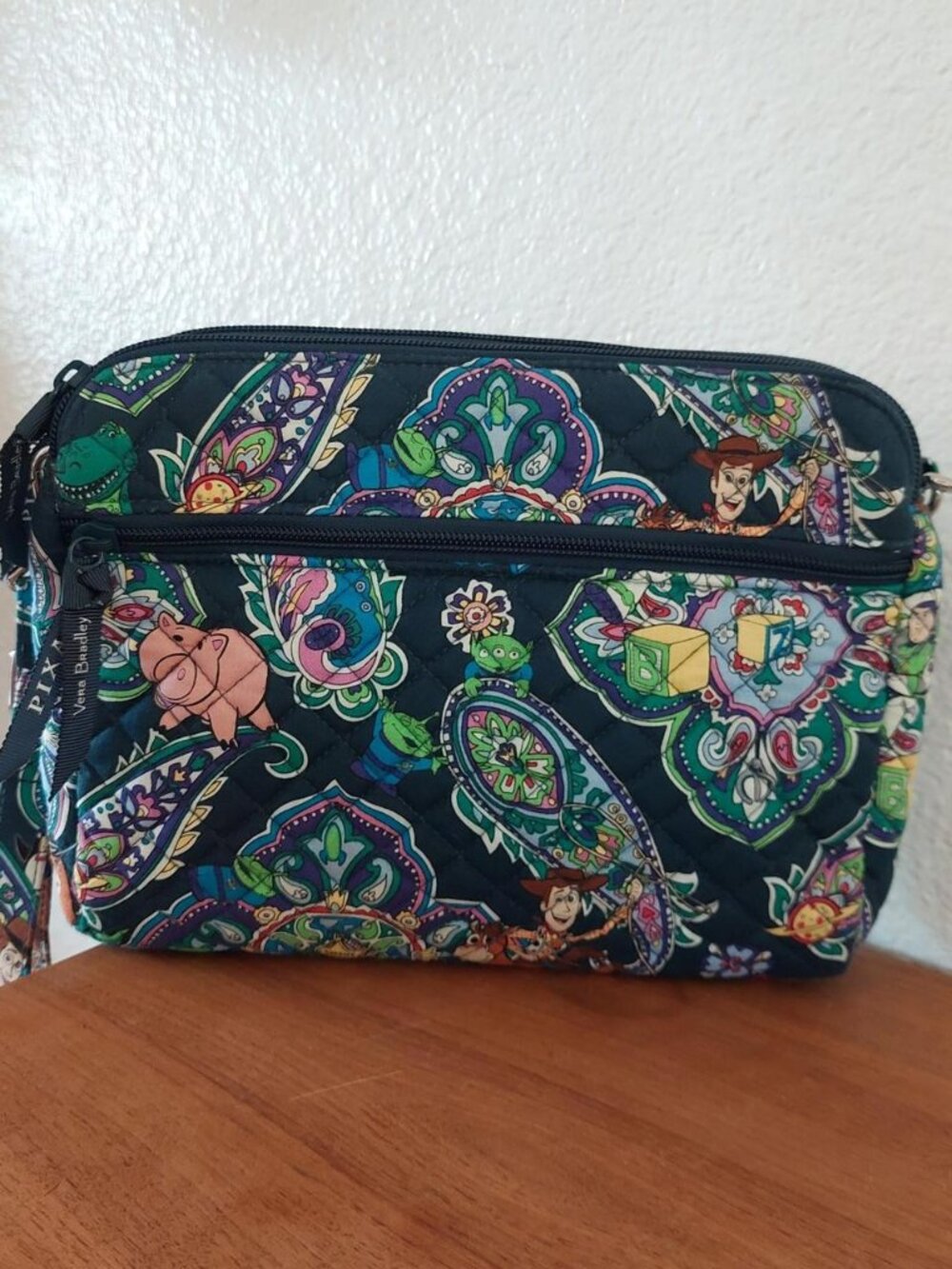 vera bradley Disney Toy Story crossbody bag with multicolored paisley and cartoo